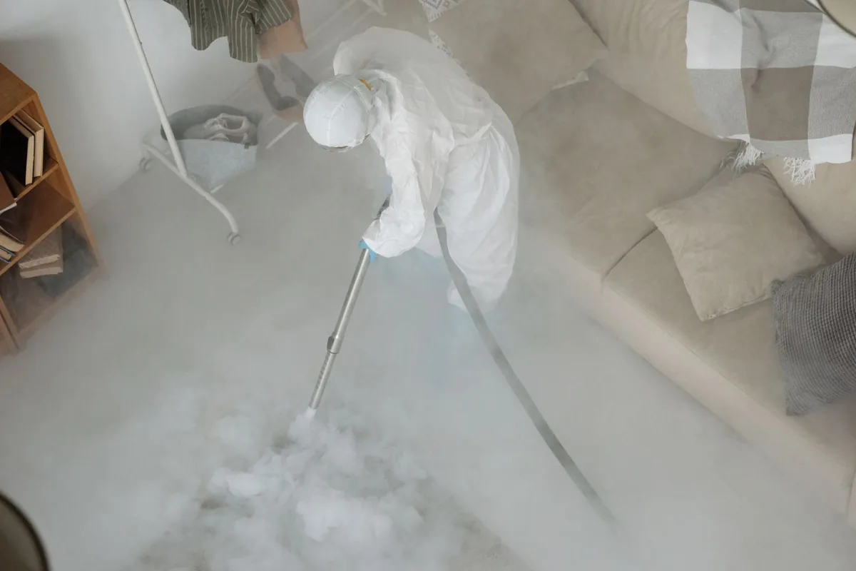 Biohazard cleanup technician in protective equipment, Thermalito, CA